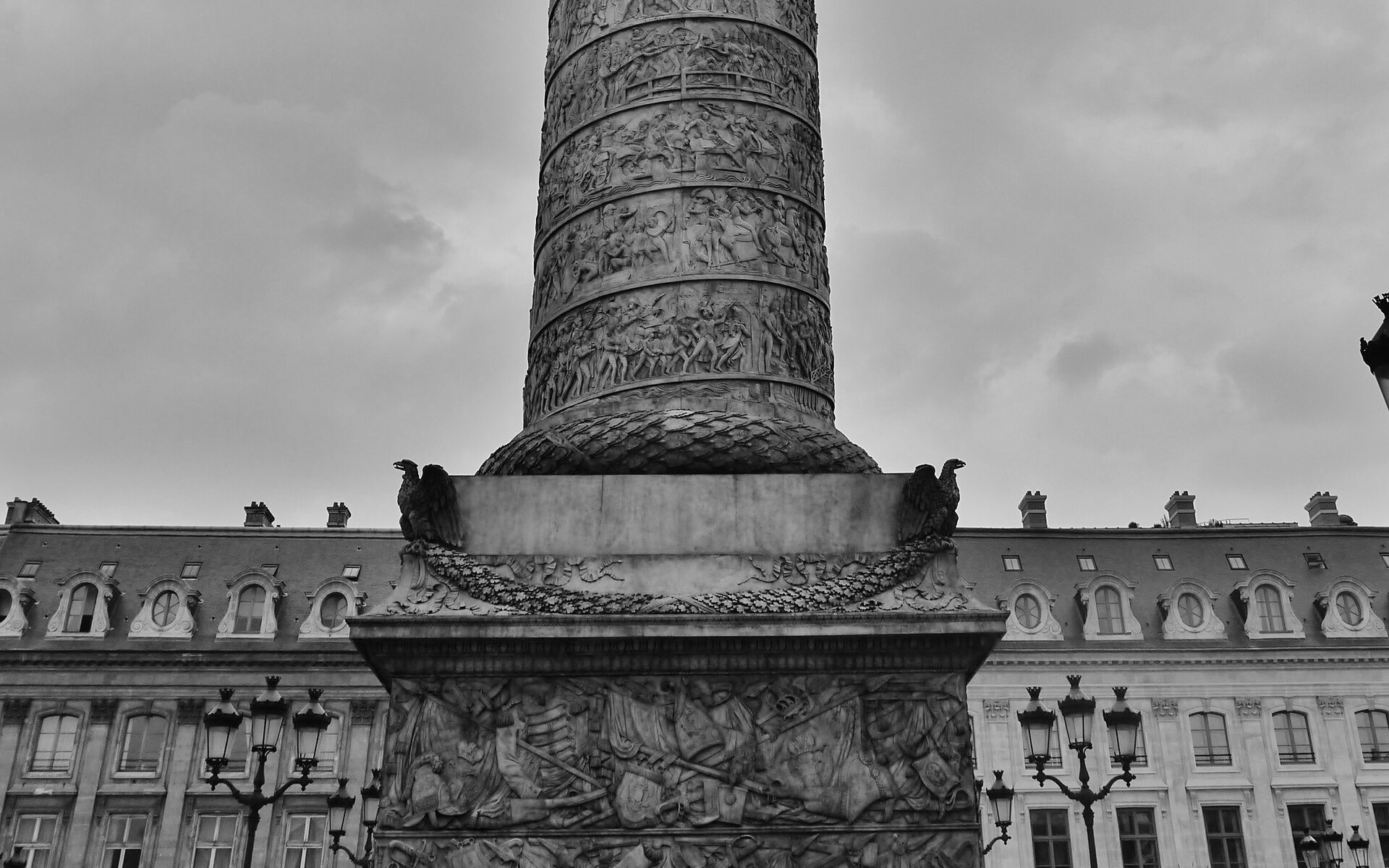 The base of the Vendôme column with the façades of Place Vendôme behind it
